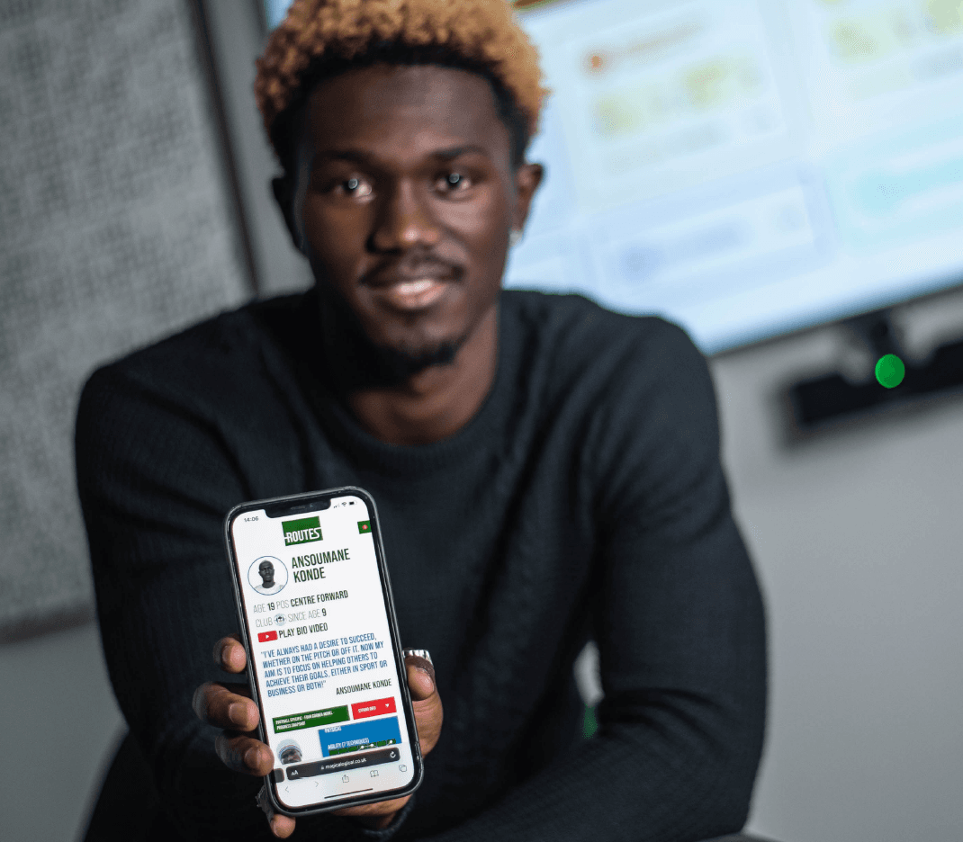 AK holding the Routes profile on a phone